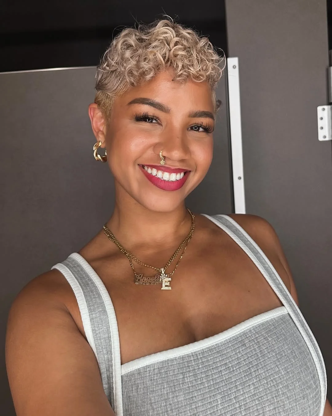 salon summer short haircuts 2026 Golden Curly Pixie With Sunlit Texture
