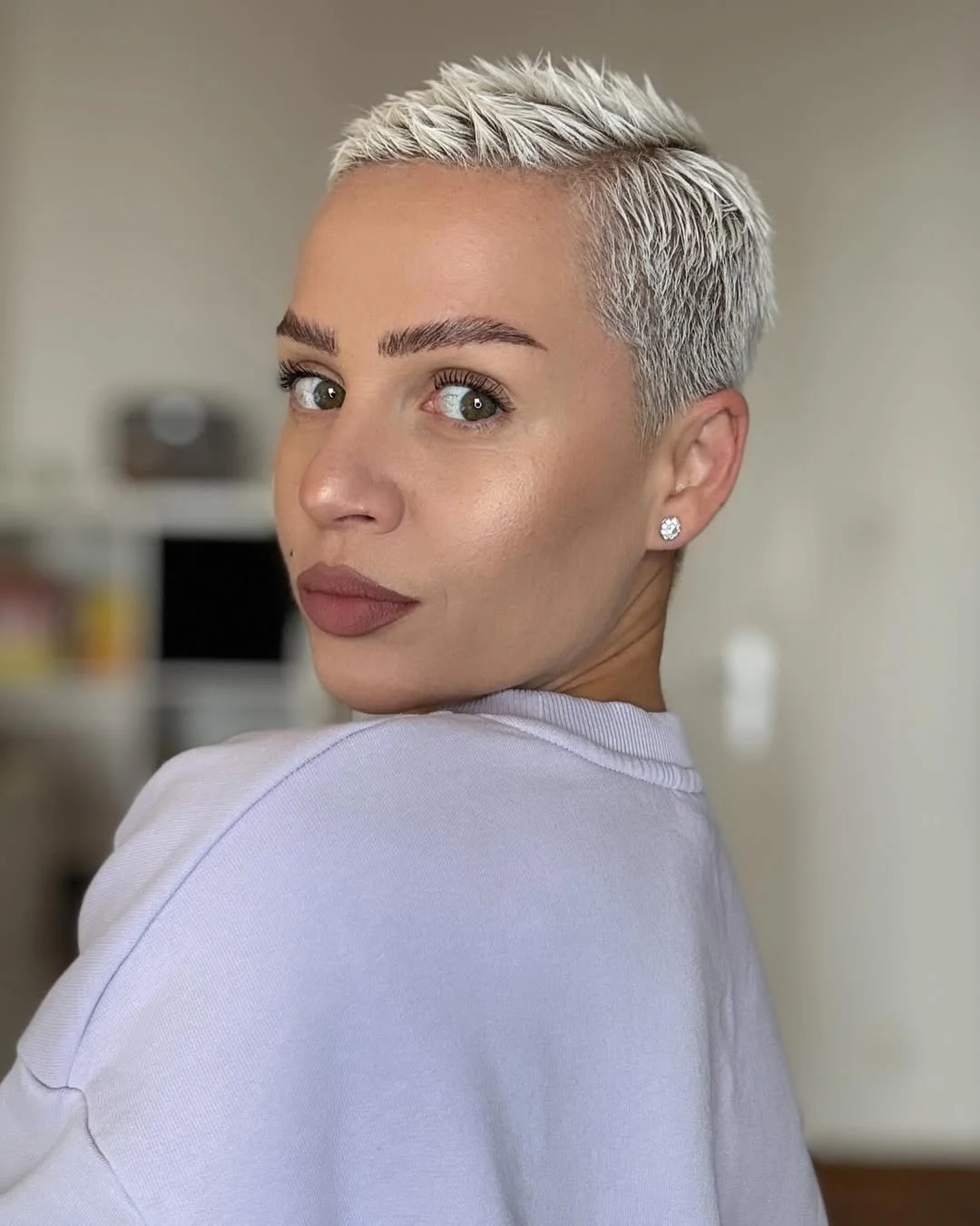 salon summer short hairstyles 2026 Platinum Buzz Pixie With Sharp Texture