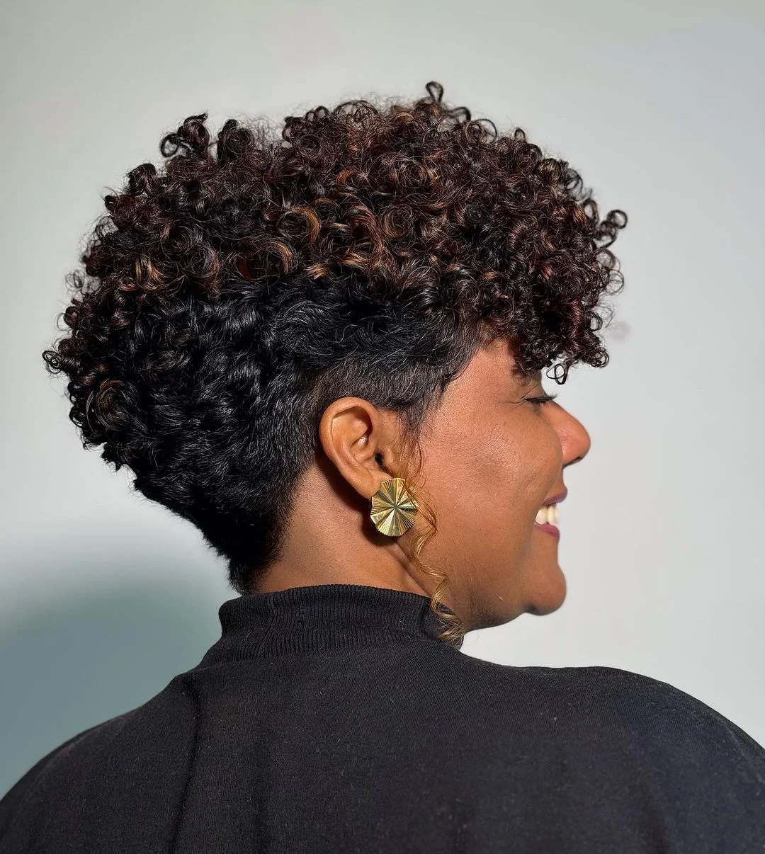 salon summer short hairstyles 2026 Defined Curly Undercut With Sculpted Volume