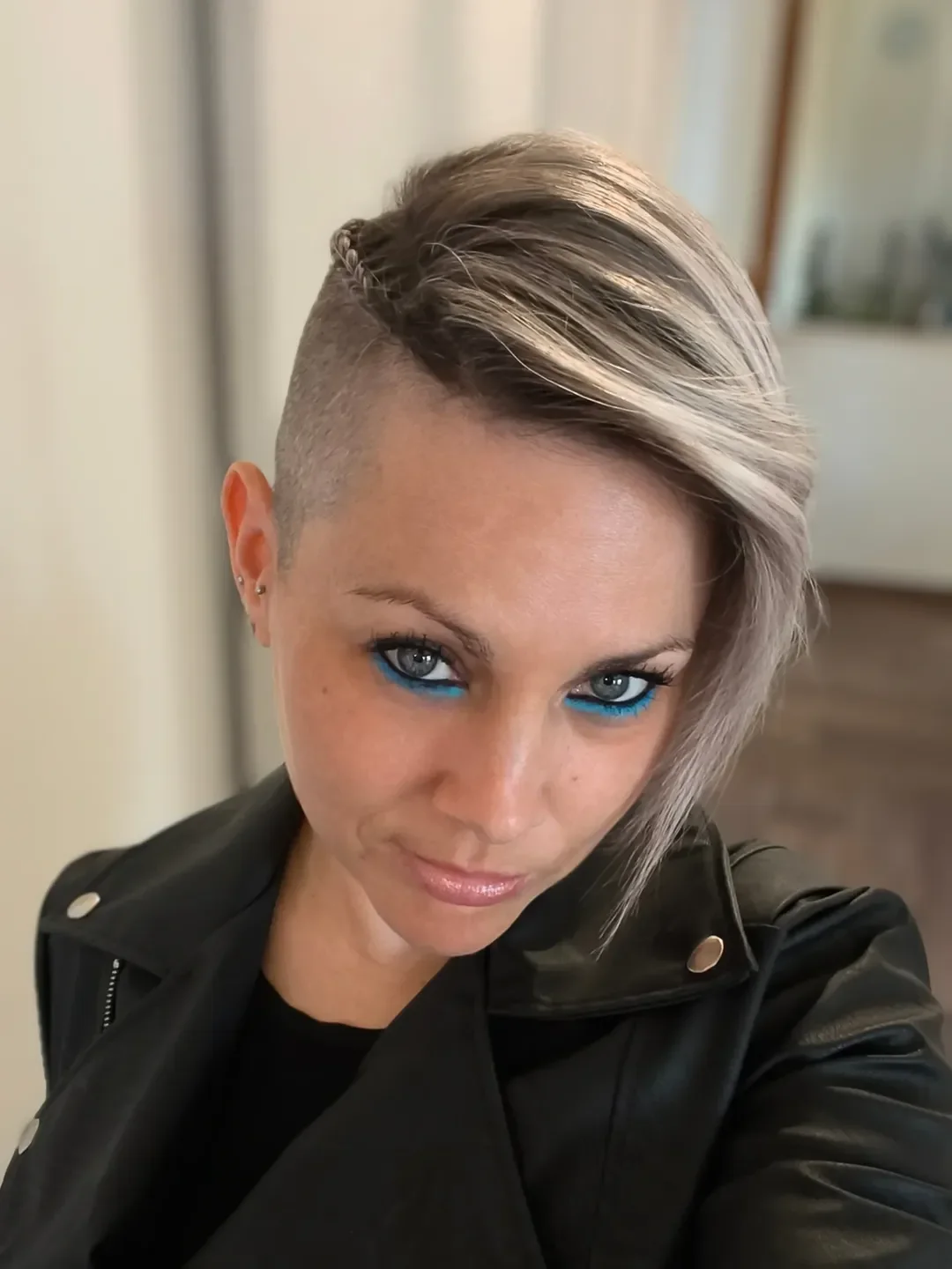 salon summer short hairstyles 2026 Silver Side Swept Undercut With Editorial Edge