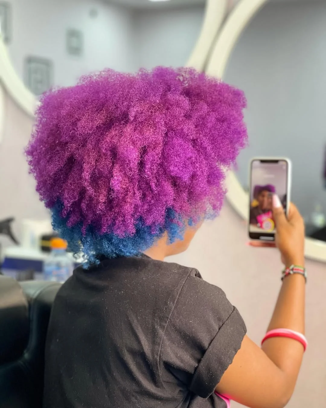 sleek summer hairstyle black women 2026 Electric Violet Coils With a Soft Summer Glow