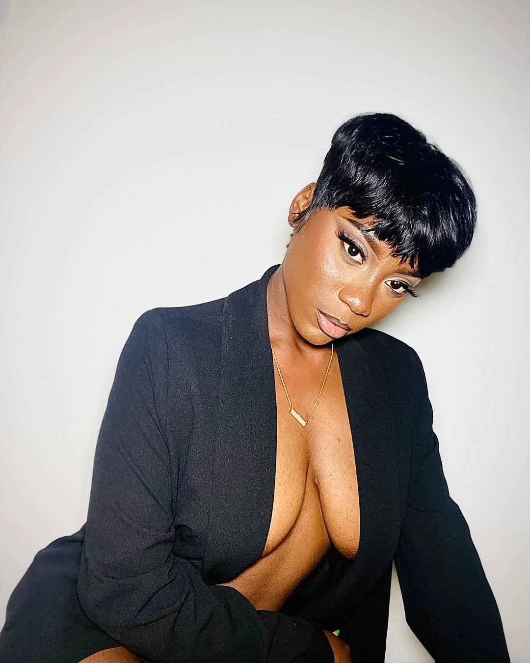 sleek summer hairstyle black women 2026 Glossy Midnight Pixie With Parisian Energy