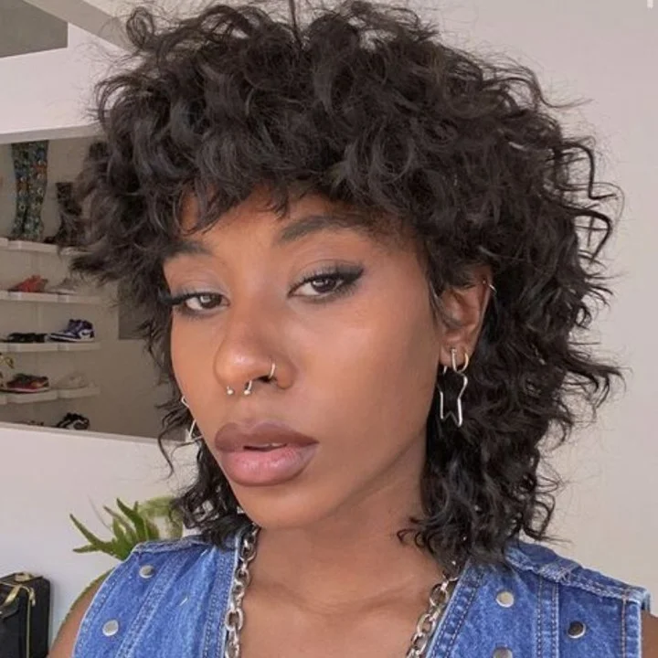 sleek summer hairstyle black women 2026 Layered Curly Shag With Downtown Energy