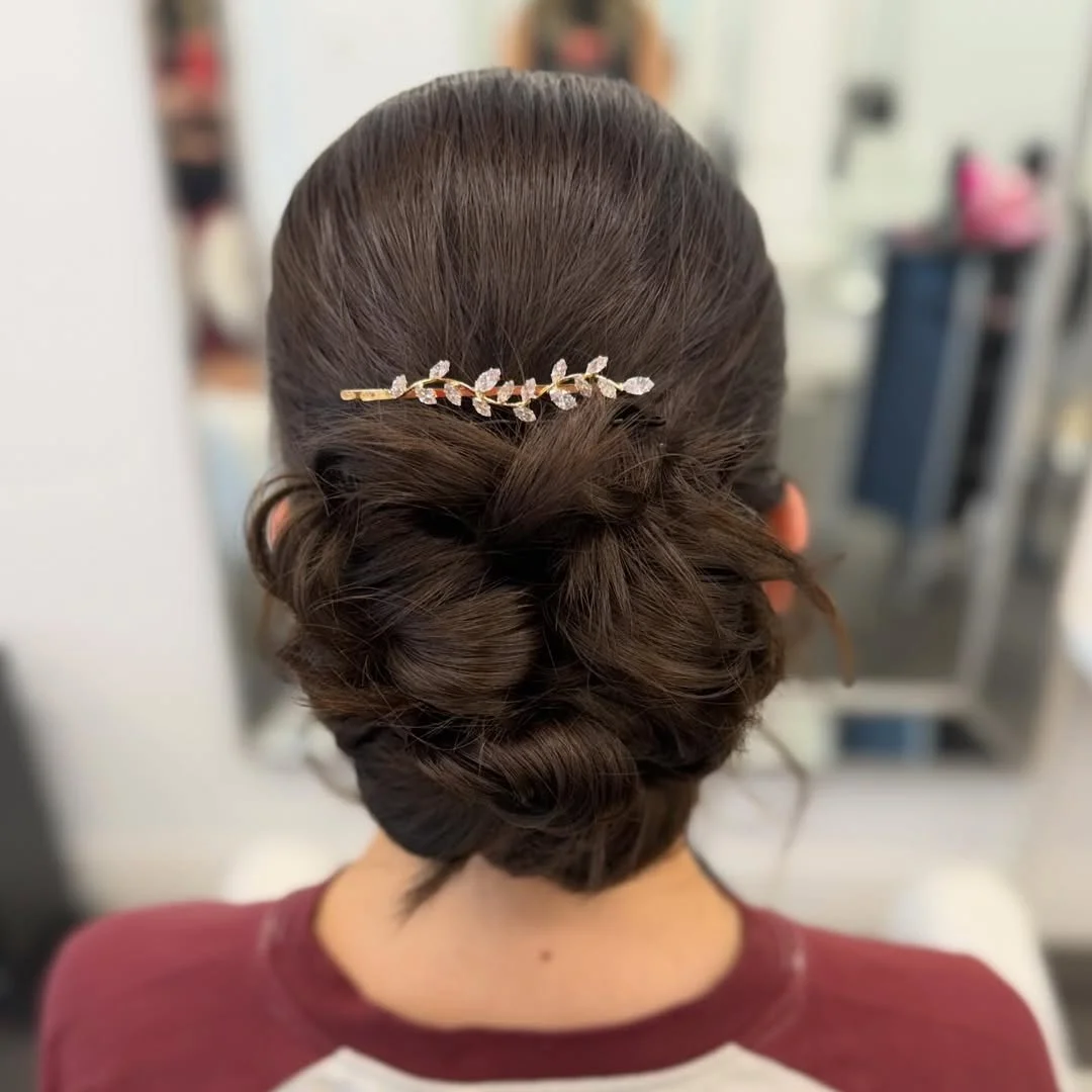sleek summer updo hairstyles 2026 Soft Brunette Chignon With Romantic Twisted Texture