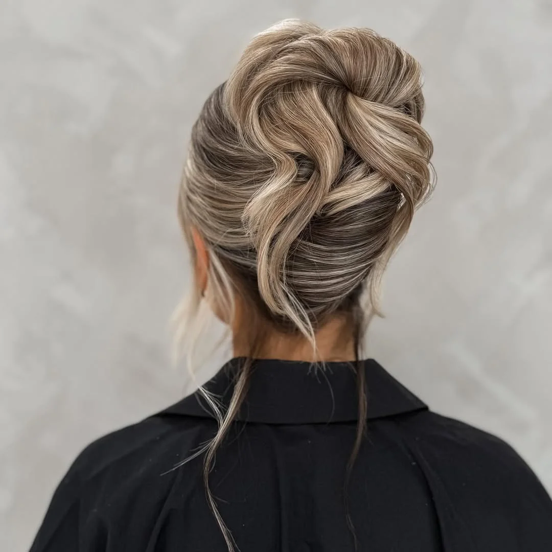 sleek summer updo hairstyles 2026 Voluminous Champagne Blonde French Twist