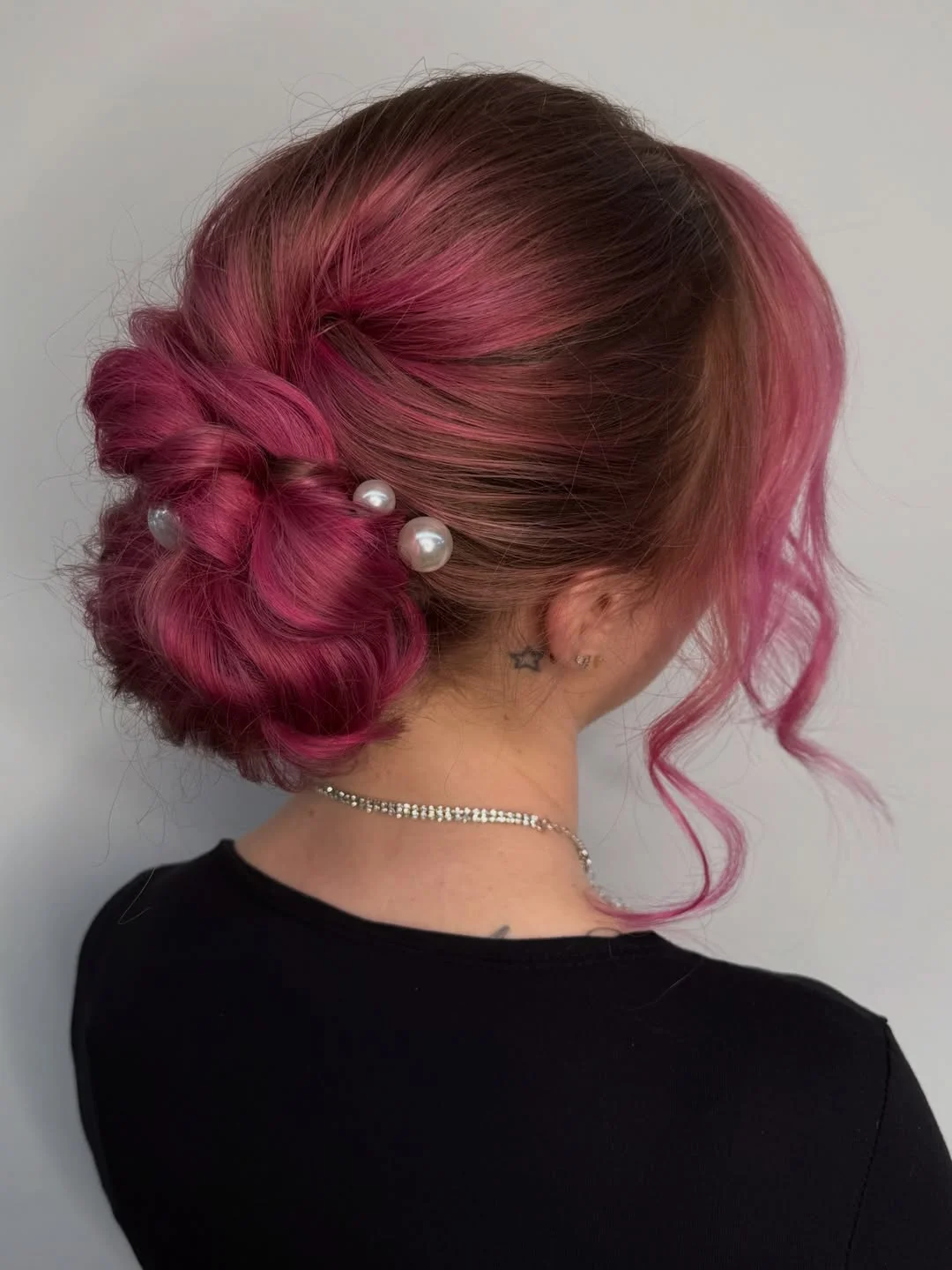 sleek summer updo hairstyles 2026 Berry Pink Sculpted Low Bun With Pearl Accents