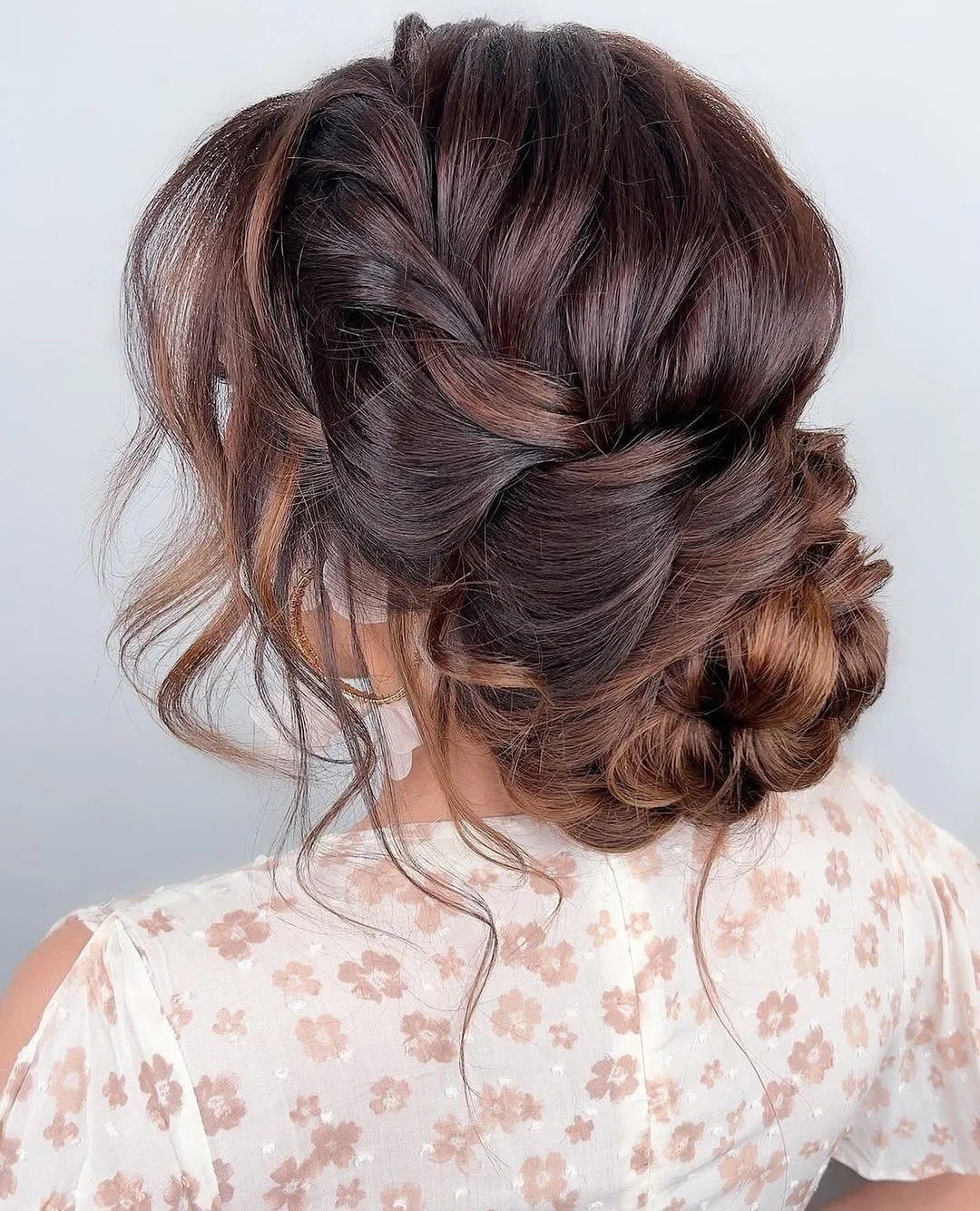 sleek summer updo hairstyles 2026 Romantic Brunette Twisted Chignon With Soft Texture