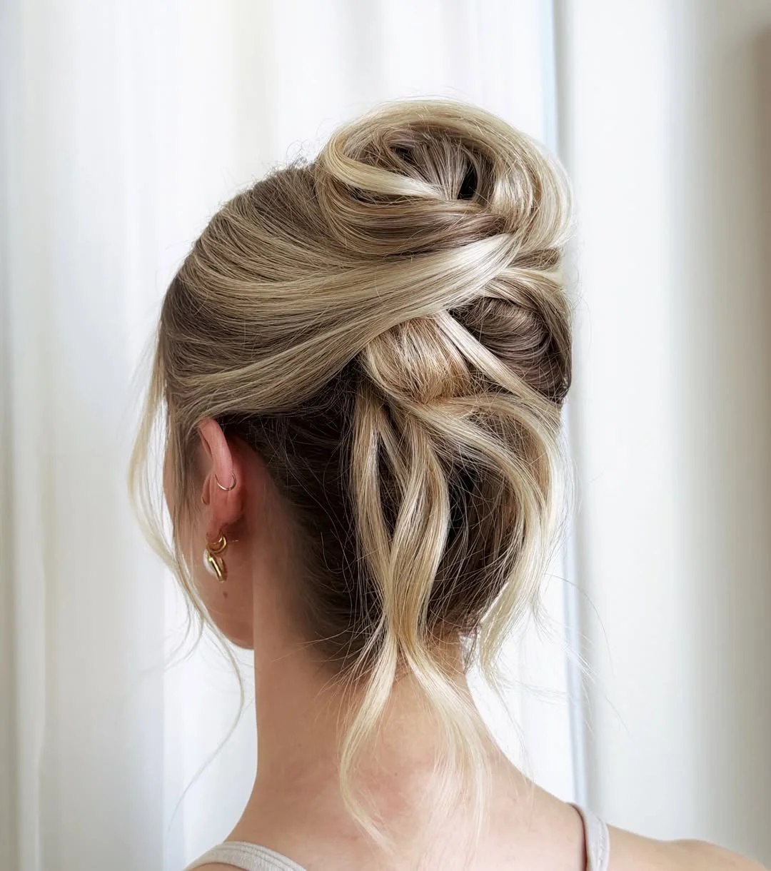 sleek summer updo hairstyles 2026 Elegant Champagne Blonde Twist Updo With Airy Length