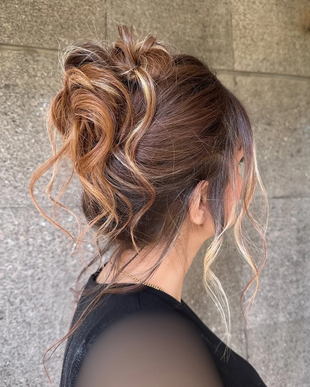 sleek summer updo hairstyles 2026 Undone High Bun With Soft Blonde Money Pieces