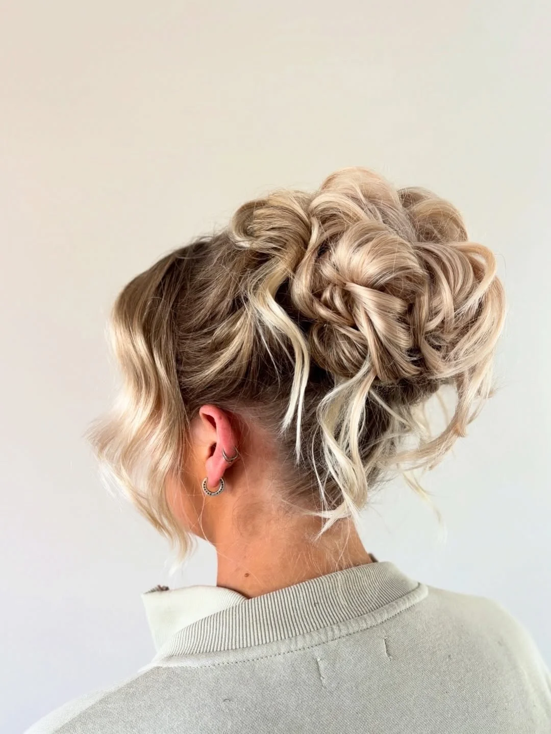 sleek summer updo hairstyles 2026 Voluminous Blonde Textured Updo With Airy Layers