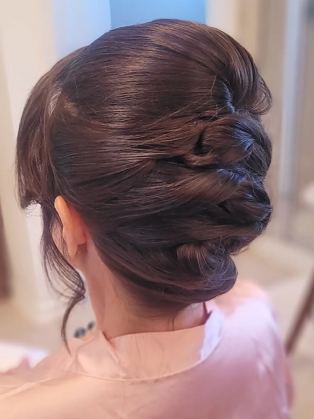 sleek summer updo hairstyles 2026 Layered Chocolate Twist Updo With Soft Volume