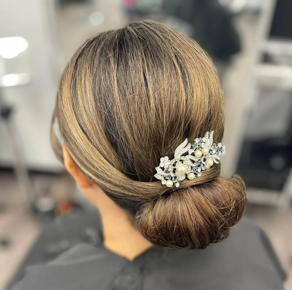 sleek summer updo hairstyles 2026 Minimalist Low Knot With Crystal Hair Accessory