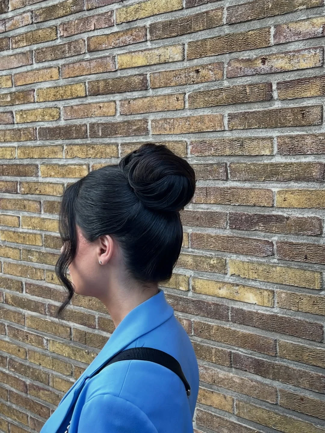 sleek summer updo hairstyles 2026 Classic Jet Black Ballet Bun With Modern Edge