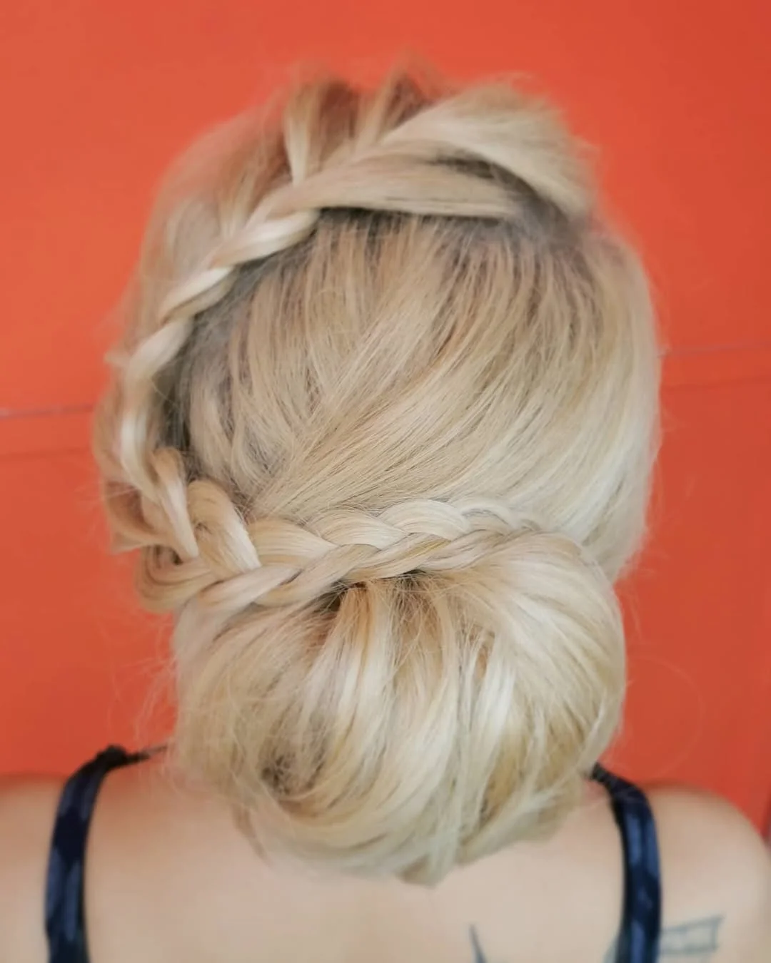 stunning summer hairstyles ideas 2026 Romantic Braided Low Bun for Warm Summer Nights