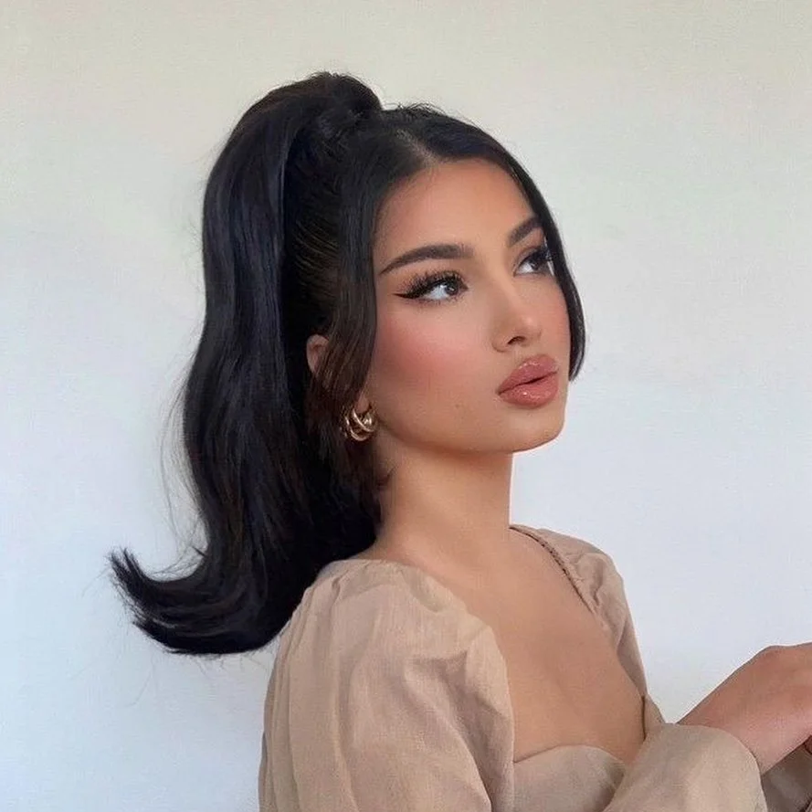 stunning summer hairstyles ideas 2026 Voluminous Retro Ponytail with Face-Framing Pieces