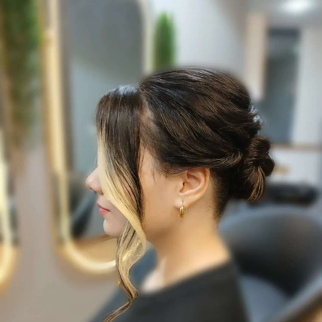 stunning summer hairstyles ideas 2026 Minimalist Twisted Low Bun with Face-Framing Contrast