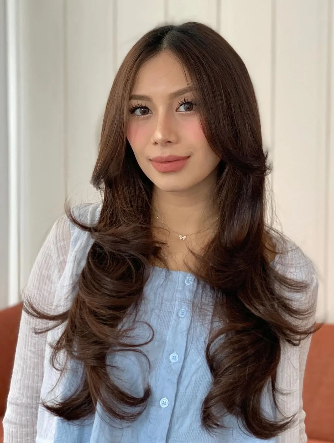 stylish summer haircut for round face 2026 Chocolate Blowout Layers With Soft Volume