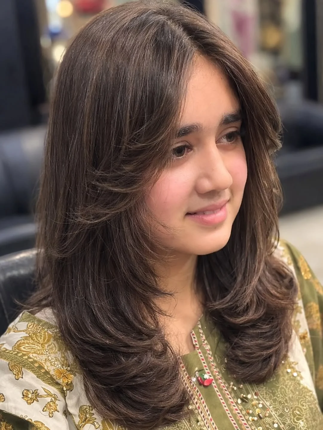 stylish summer haircut for round face 2026 Feathered Brunette Layers With Airy Dimension