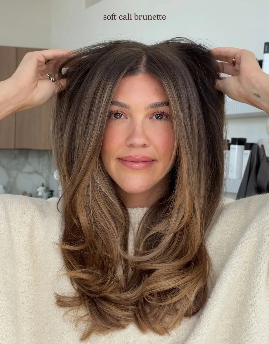 stylish summer haircut for round face 2026 Soft Cali Brunette Layers With Air-Dried Volume