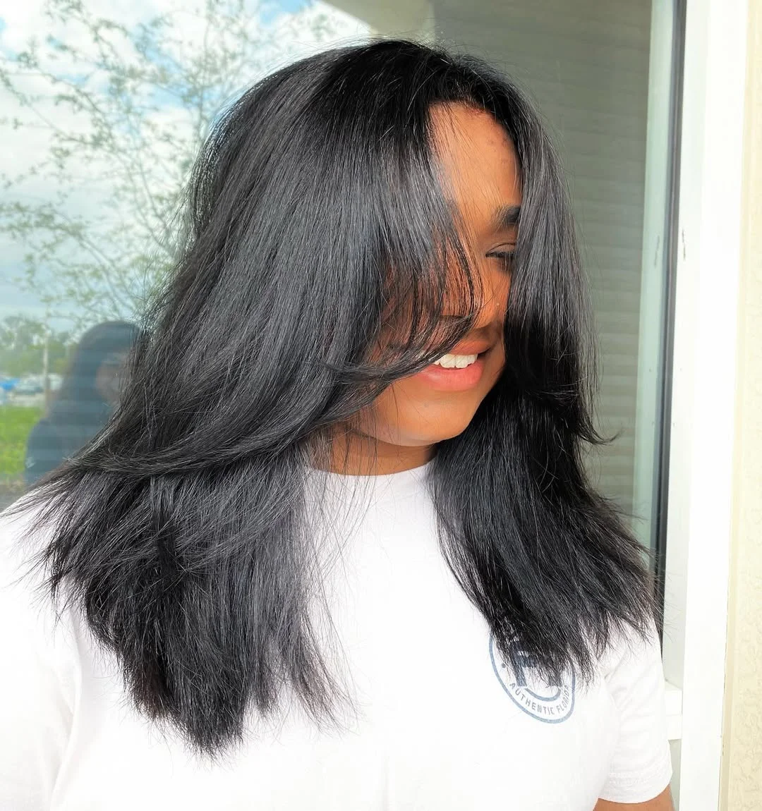 stylish summer haircut for round face 2026 Long Layered Black Hair With Wispy Curtain Bangs