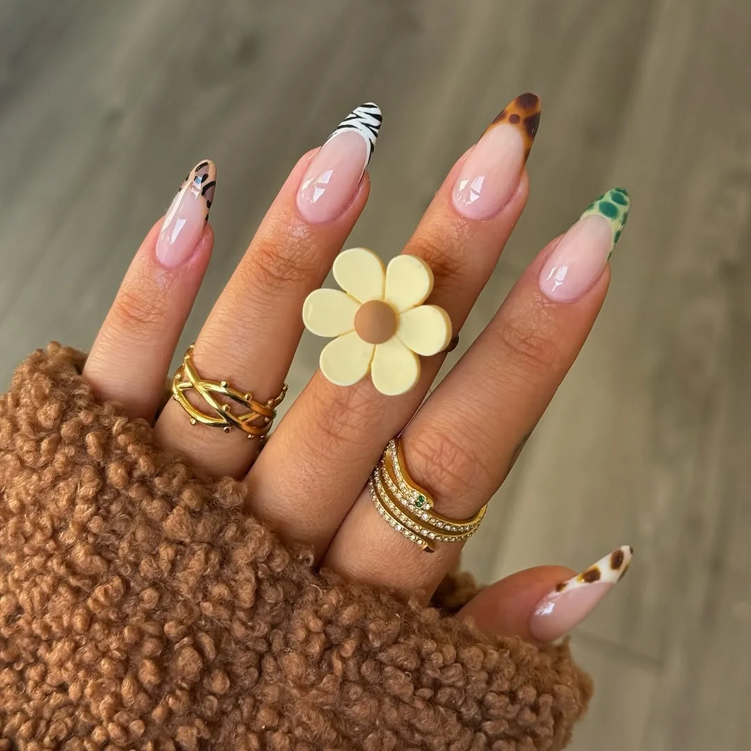 summer toe nails colors 2026 Mixed Animal Print French Tips With Earthy Summer Tones