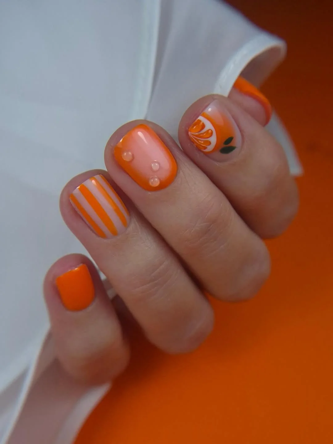 summer toe nails colors 2026 Juicy Orange Citrus Nails With Playful Retro Details