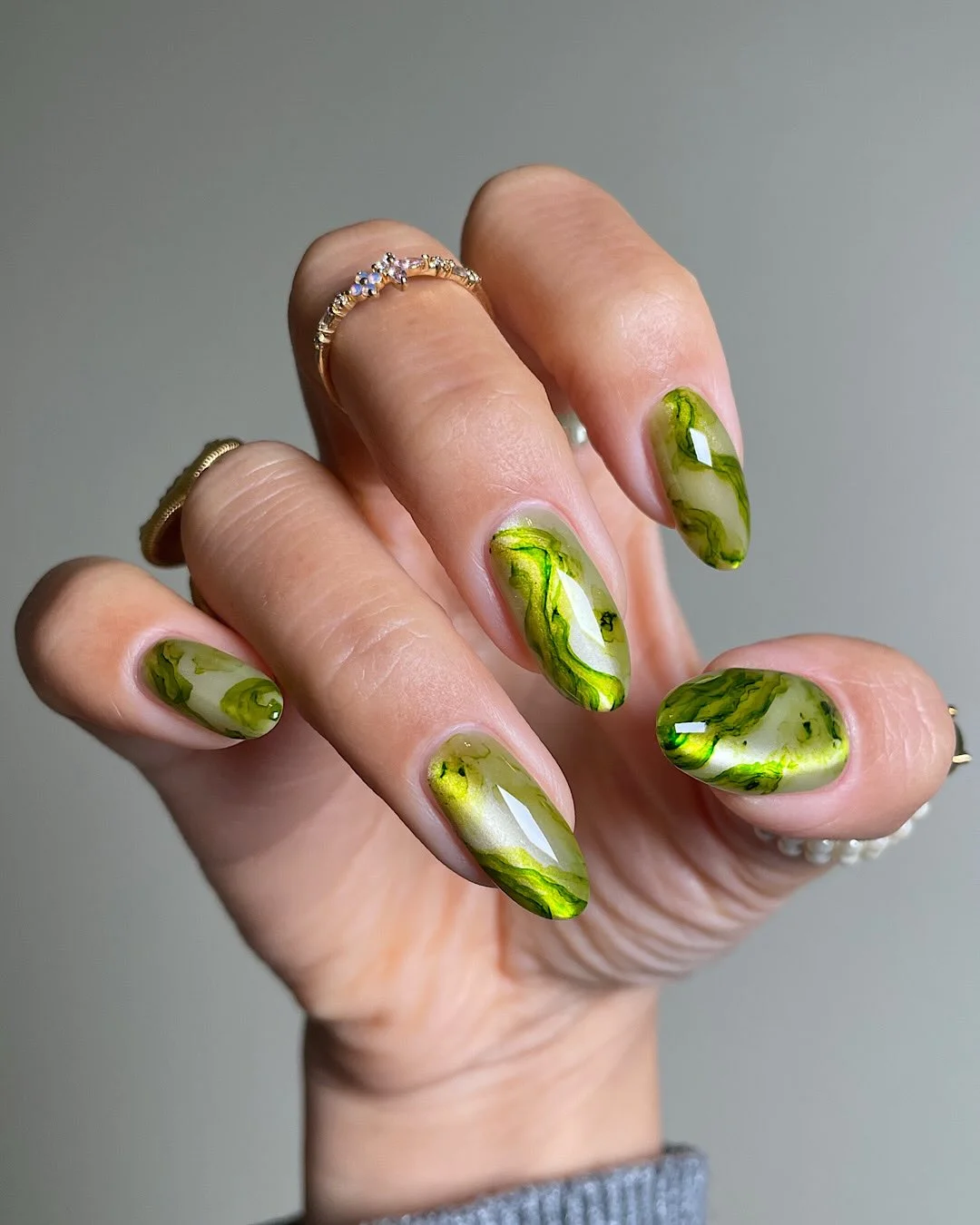 summer toe nails colors 2026 Glossy Green Marble Nails With Botanical Stone Effects