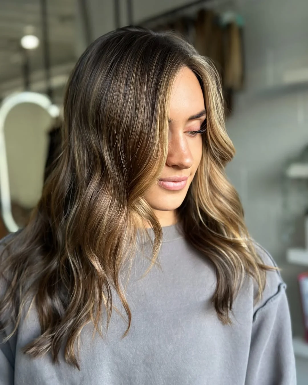 summer hair color ideas to inspire you 2026 Dimensional Mocha Waves with Light Ribbons