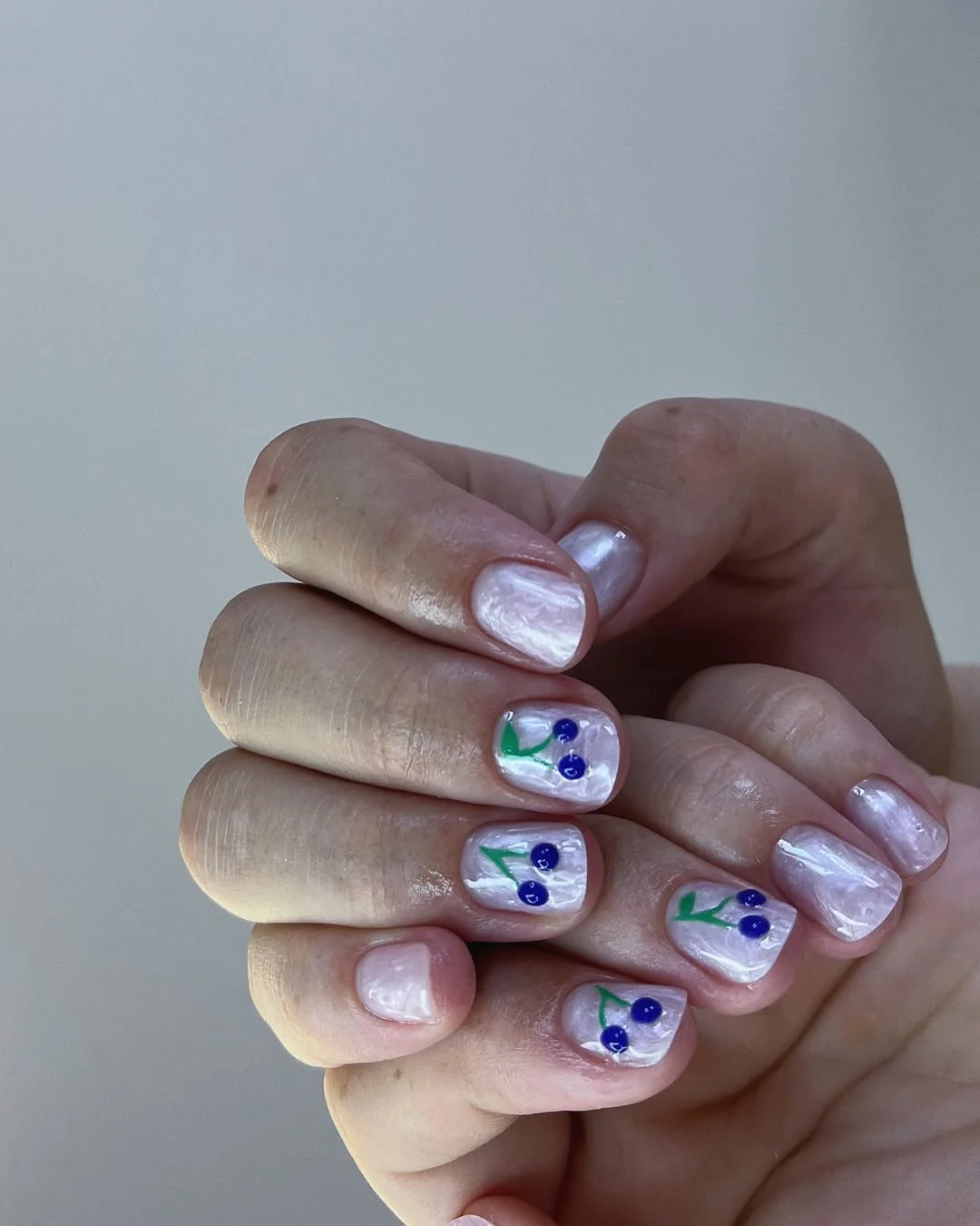 summer manicure color ideas 2026 Milky Pearl Cherry Nails With a Soft Glossy Finish