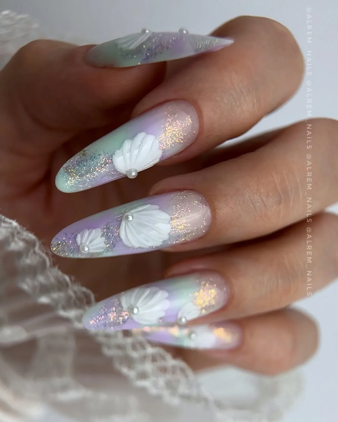 summer nail colors 2026 Pastel Seashell Nails With Mermaid-Core Sparkle