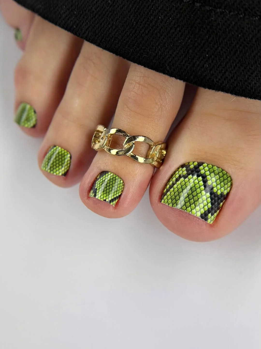 summer toe nails colors 2026 Neon Snake Print Pedicures for Girls Who Want Something Edgy