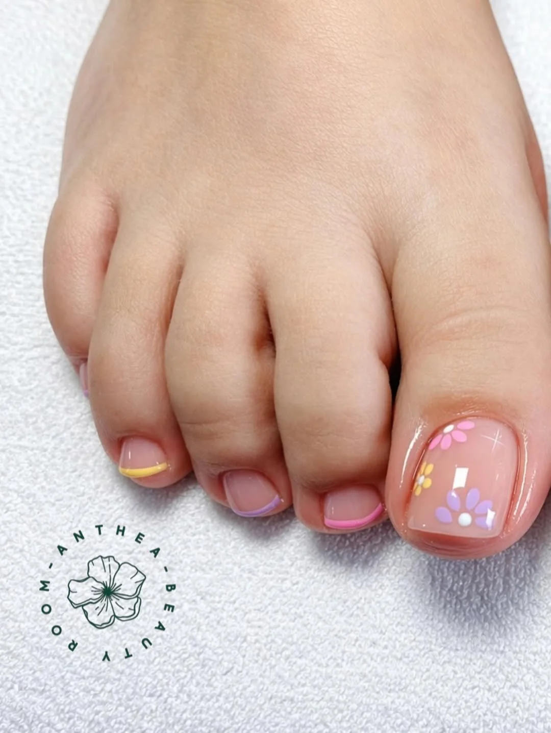 summer toe nails colors 2026 Pastel Daisy French Tips With Soft Y2K Charm