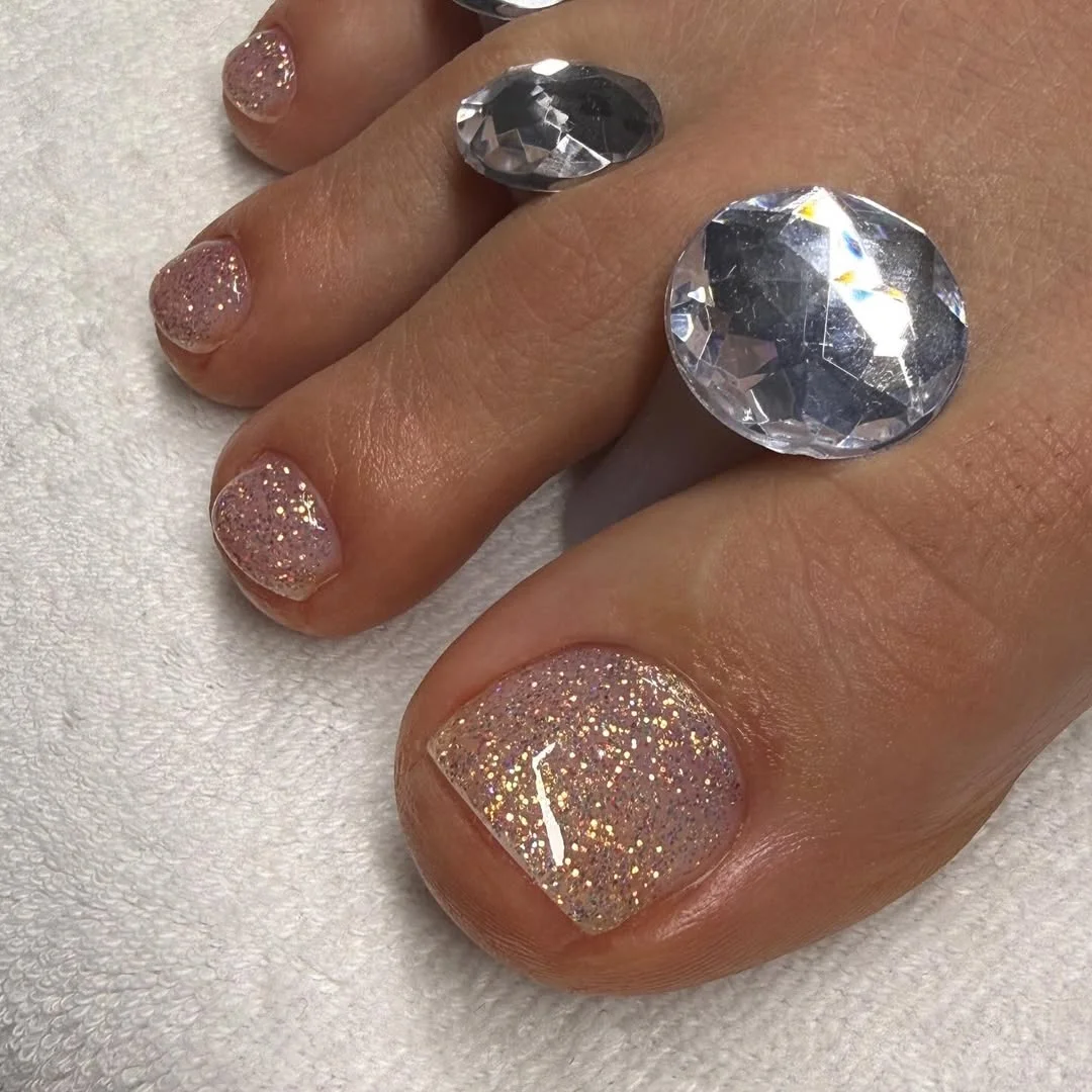 summer toe nails colors 2026 Champagne Glitter Pedicures That Catch Every Bit of Sunlight