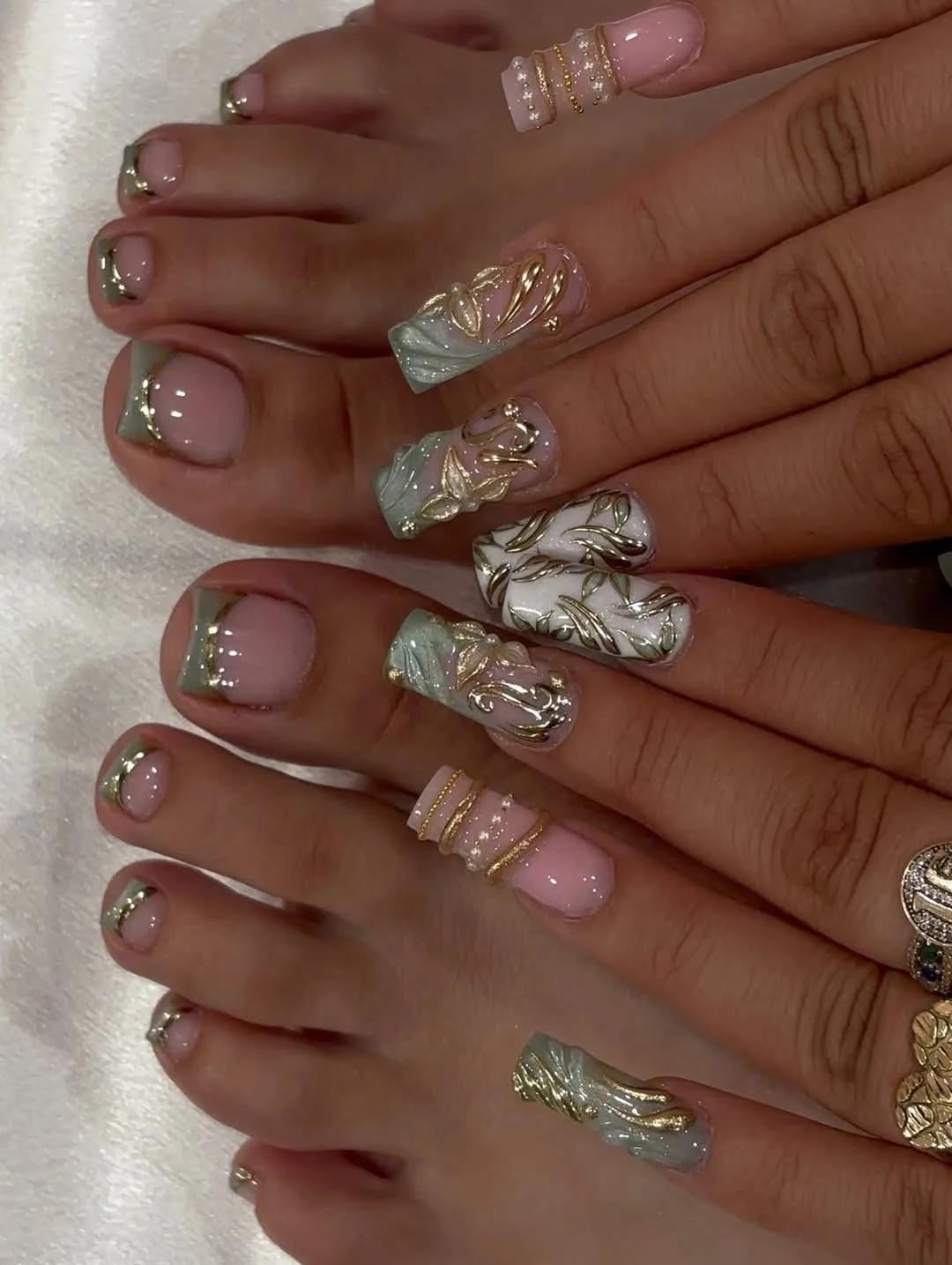 summer toe nails colors 2026 Gold-Trimmed Sage French Tips With Luxury Resort Energy