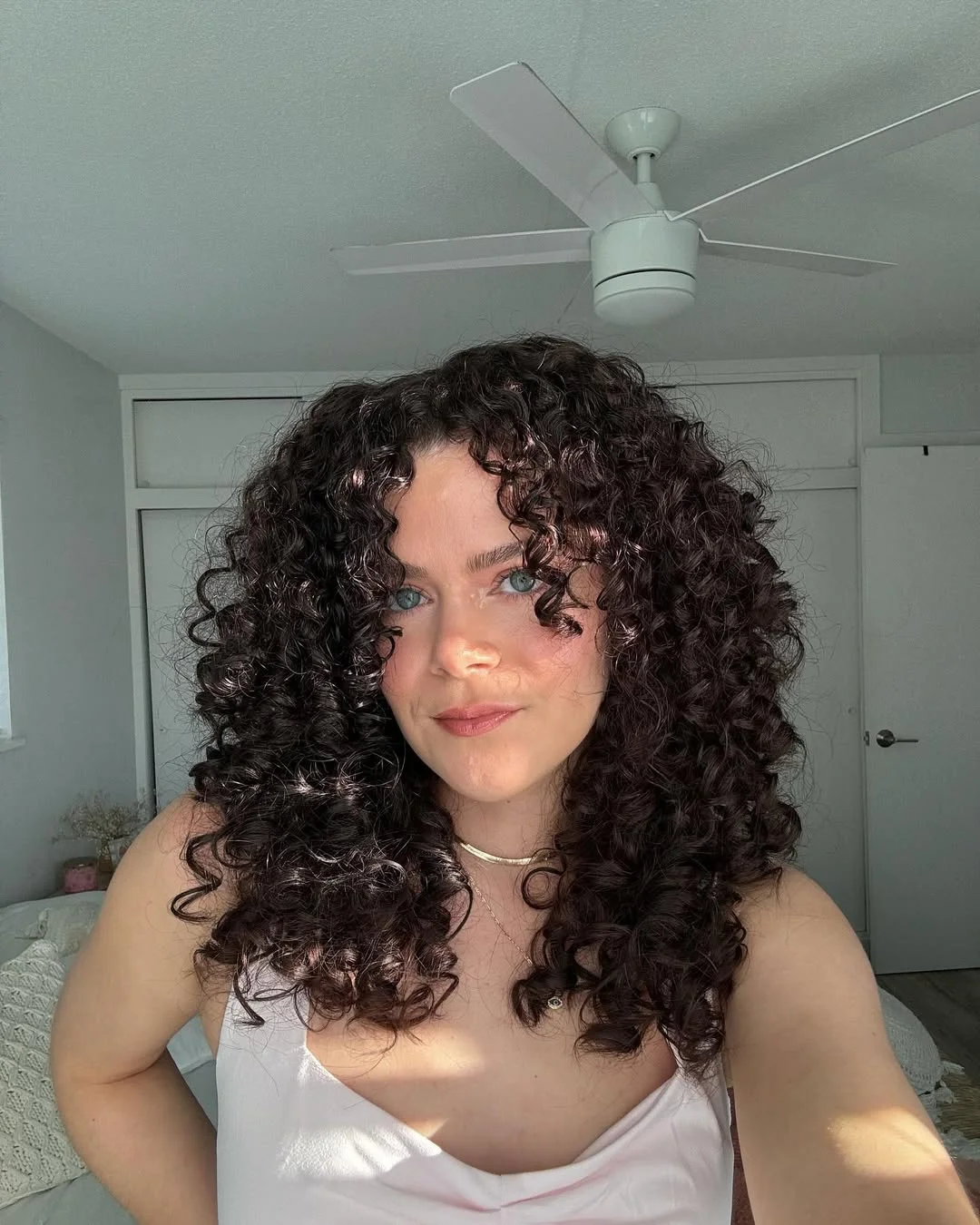 trendy summer brunette hair color 2026 Rich Chocolate Curls With Natural Summer Volume