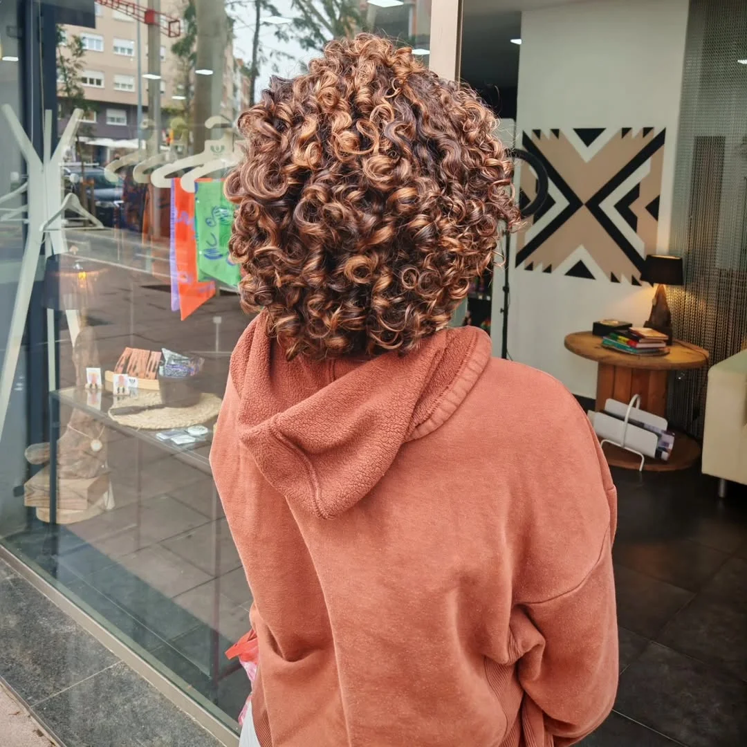trendy summer brunette hair color 2026 Short Curly Brunette With Copper Dimension