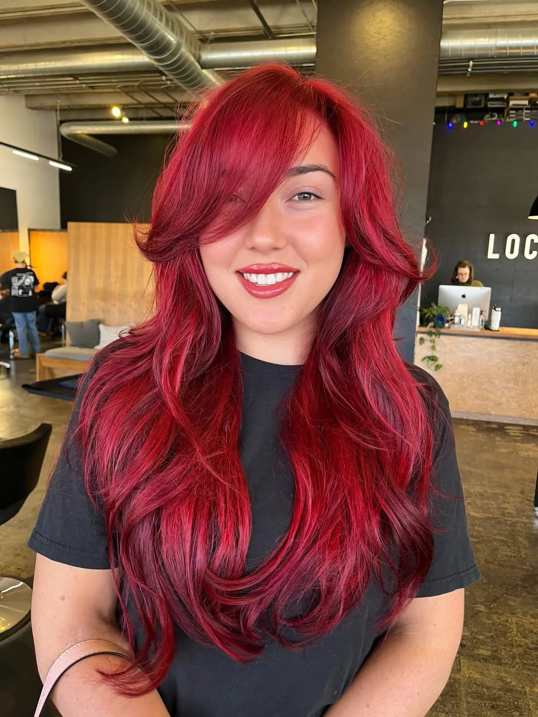 trendy summer red hair color 2026 Voluminous Red Layers with Face Framing Bangs Energy
