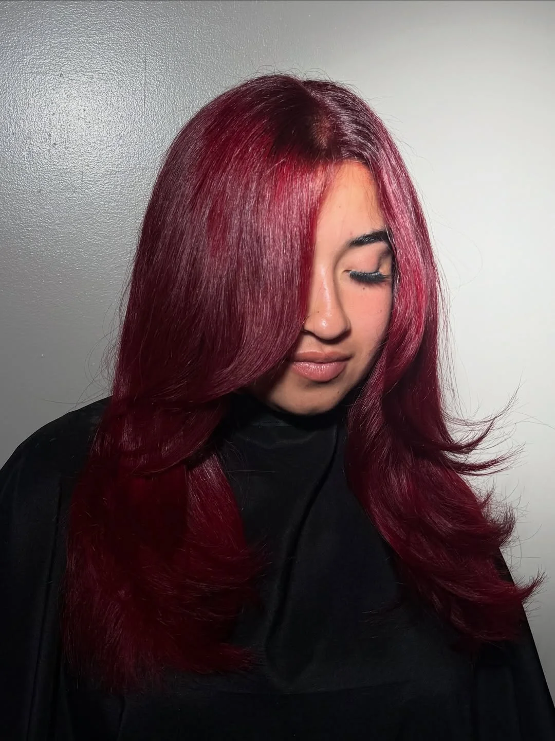 trendy summer red hair color 2026 Deep Velvet Red with Smooth Layered Finish