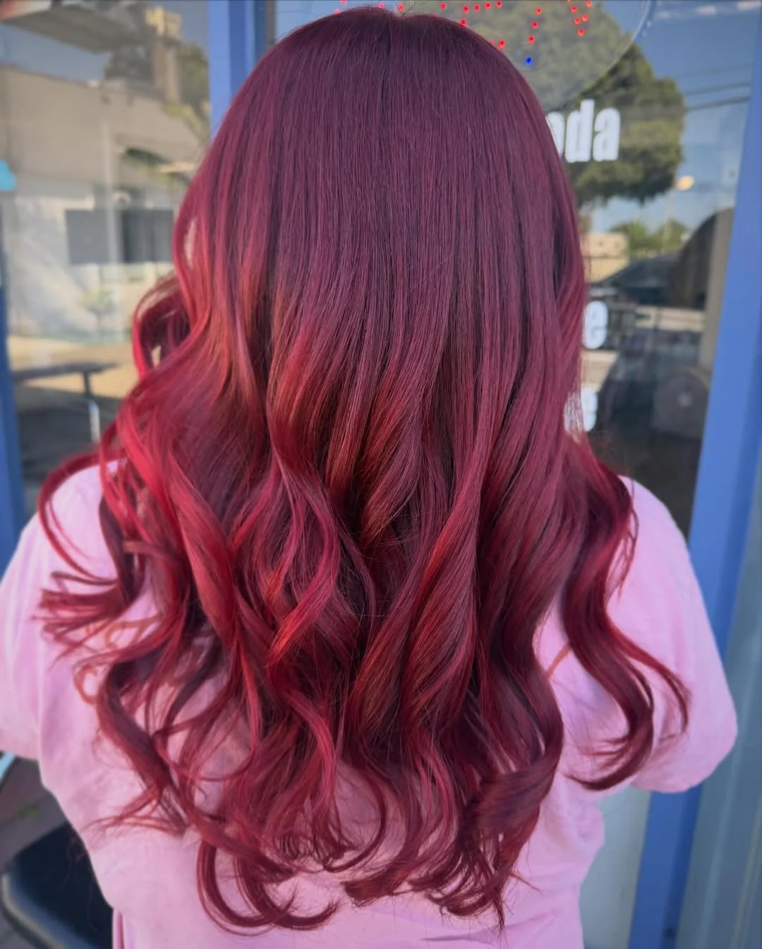 trendy summer red hair color 2026 Glossy Cherry Waves with Light Reflective Highlights