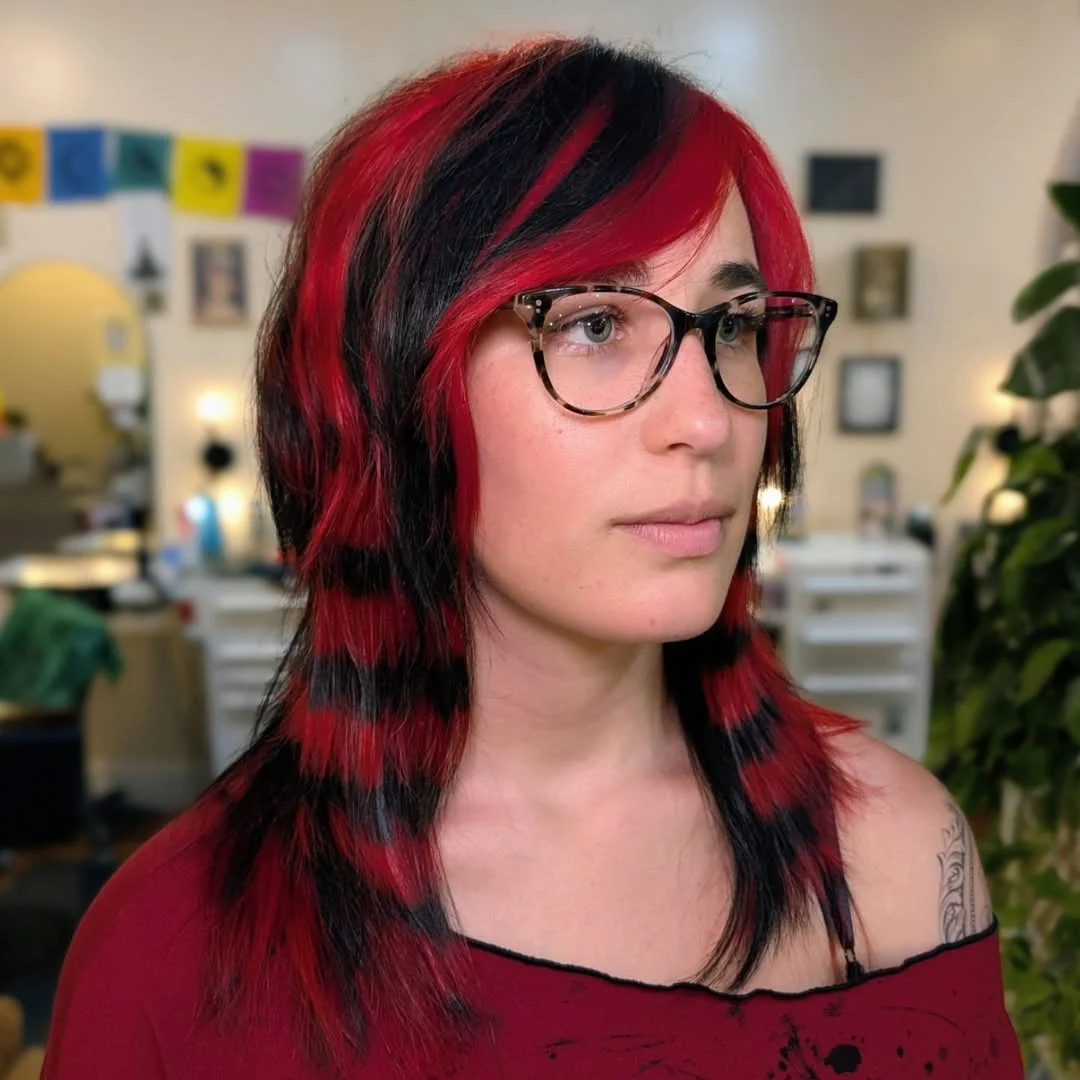 trendy summer red hair color 2026 Graphic Red and Black Contrast for a Bold Statement Cut