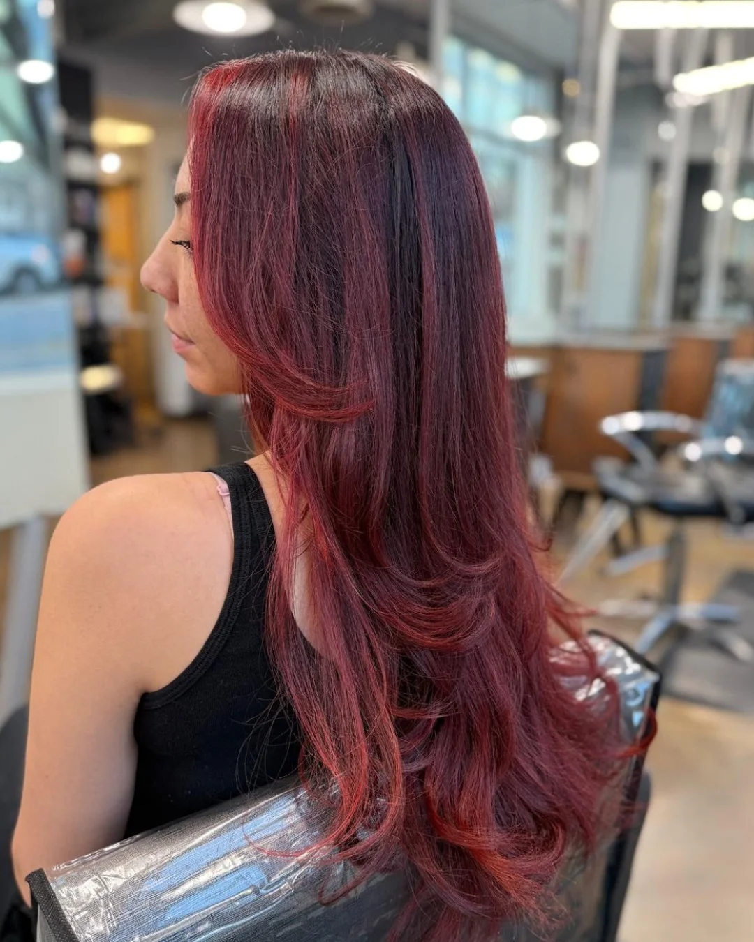 trendy summer red hair color 2026 Layered Red with Subtle Highlights for Natural Dimension