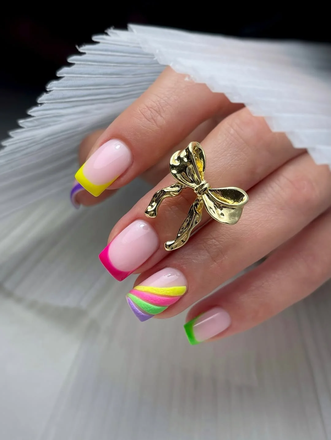 bright summer nails 2026 Neon French Tips with Candy Swirl Accents