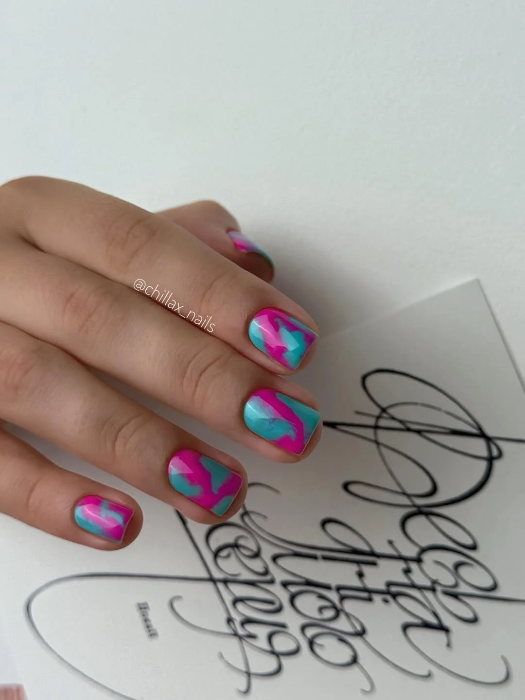 bright summer nails 2026 Electric Marble Swirls in Pink and Blue