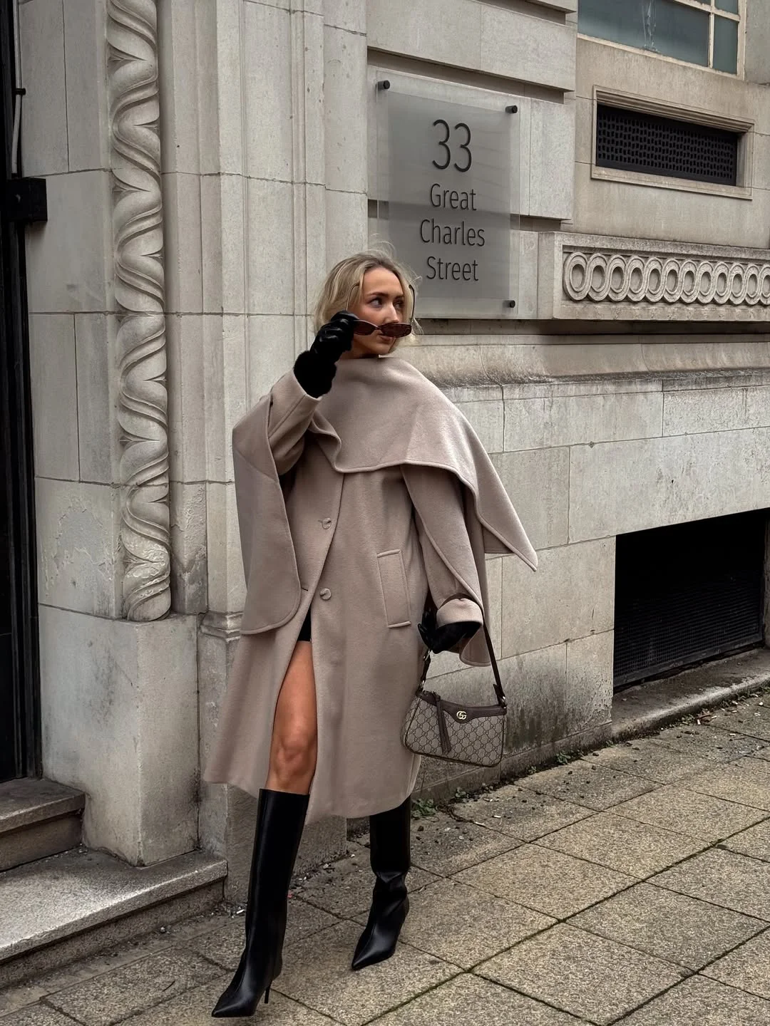 cozy chic fall outfits for 2026 A Draped Cape Coat Creates Quiet Luxury