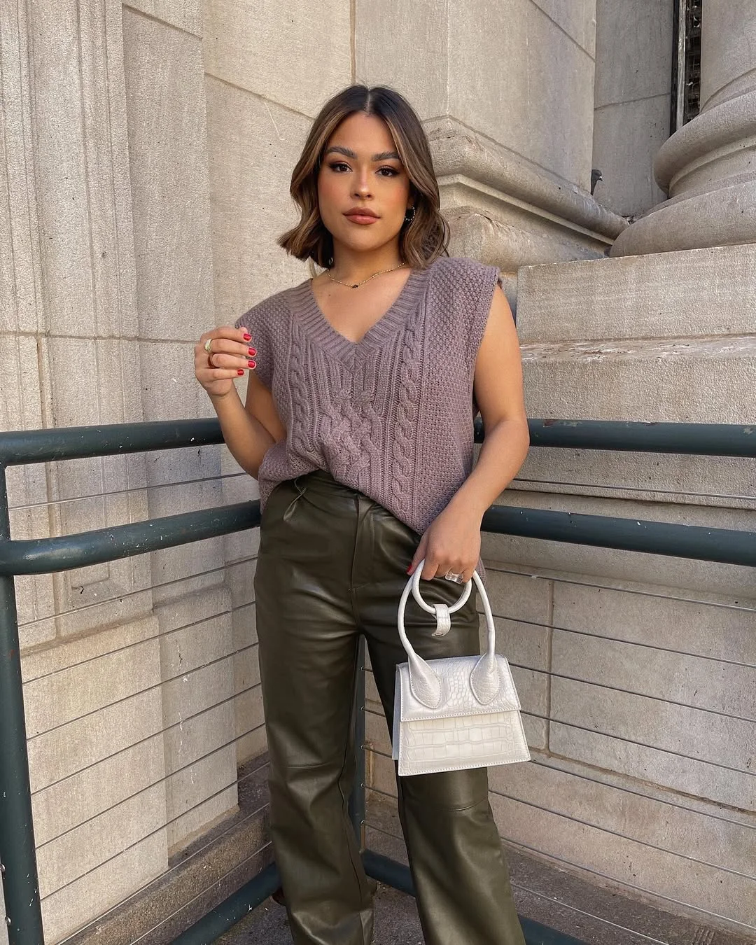 fall office outfits for women 2026 A Sweater Vest That Makes Leather Pants Office Ready