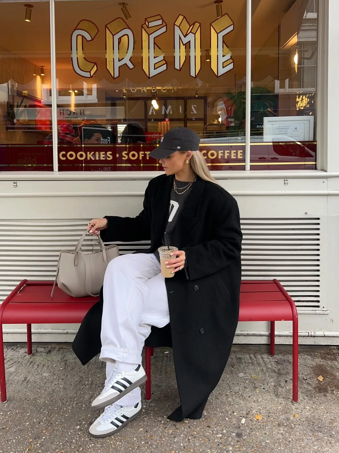 fall outfits with jeans and sneakers 2026 Relaxed Black Coat and White Denim Contrast