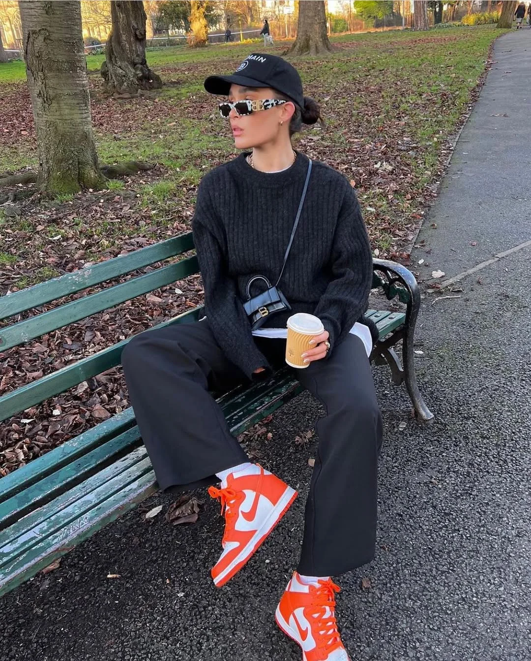 fall outfits with sneakers 2026 Bright Sneakers with Dark Knitwear for an Effortless Weekend Look