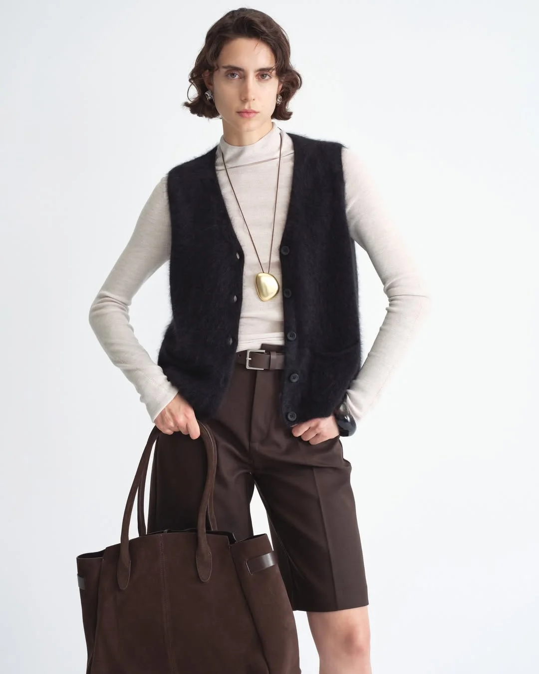 fall outfits with vests 2026 Minimal Black Knit Styling With Quiet Luxury Appeal