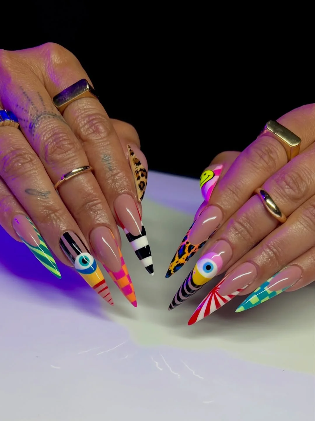 funky summer nails 2026 Graphic Stiletto Nails for Maximum Drama