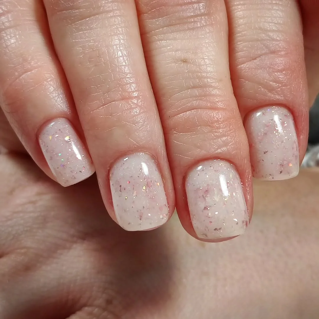 short squoval nails design 2026 Soft Milky Sparkle with a Whisper of Light